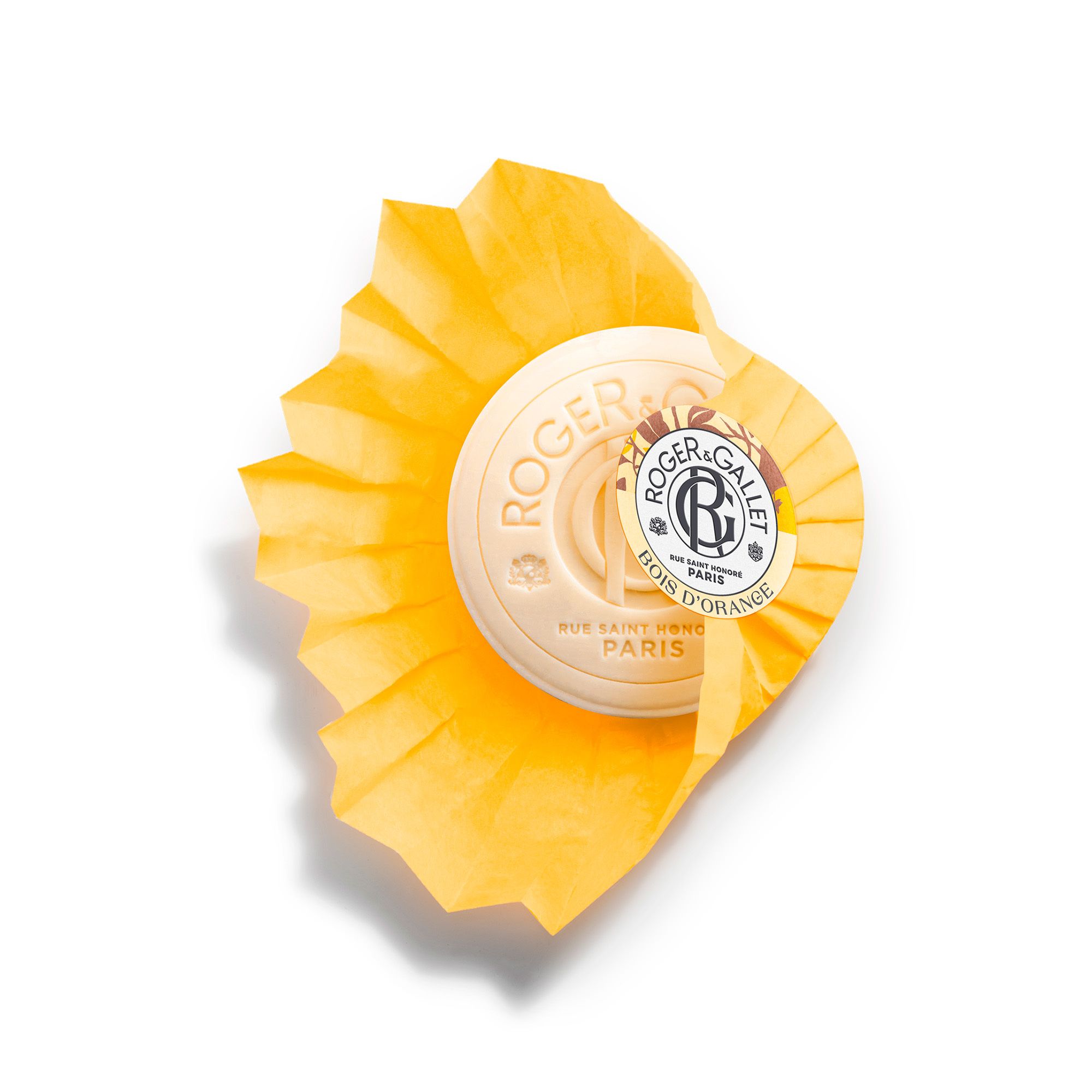 Zeep in geel papier. Logo Roger & Gallet, Bois d'Orange. Papier gedeeltelijk open.