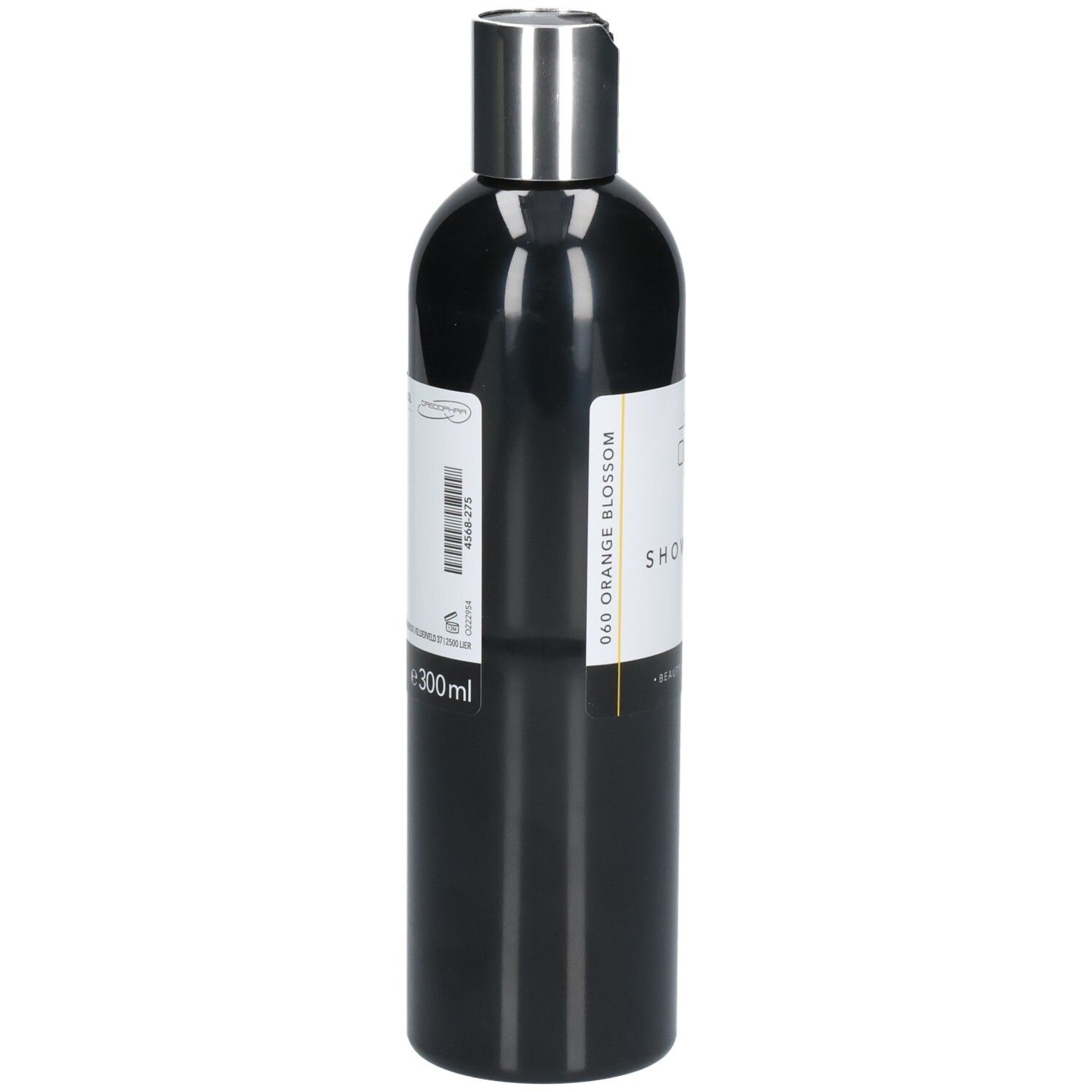Zwarte fles met zilveren dop. Wit etiket met productinformatie. Tekst: "Shower Oil". Volume: 300ml.