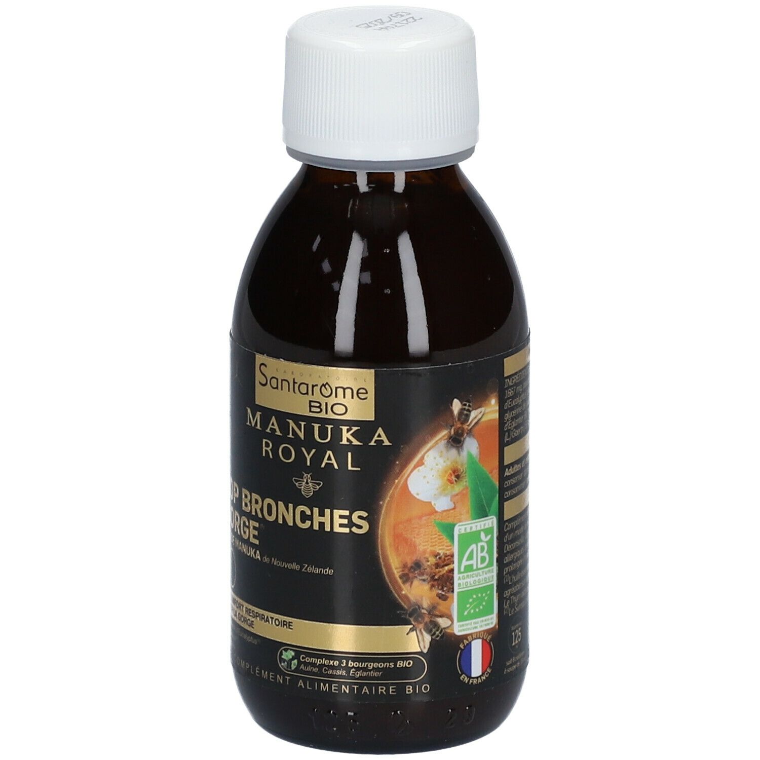 Bruine fles met witte dop. Etiket met productnaam, Manuka honing motief en bio-label. Franse tekst.