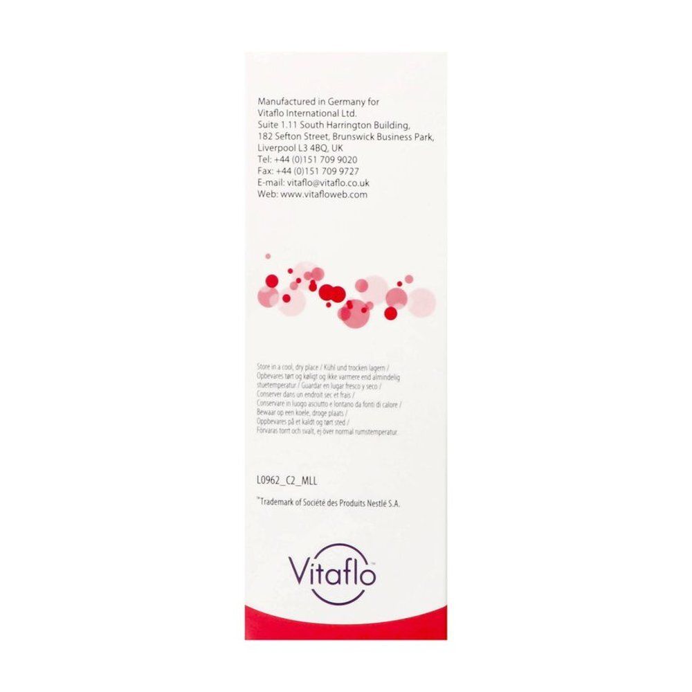 Emballage étroit blanc avec motif de cercles rouges. Marque: Vitaflo. Texte en anglais.