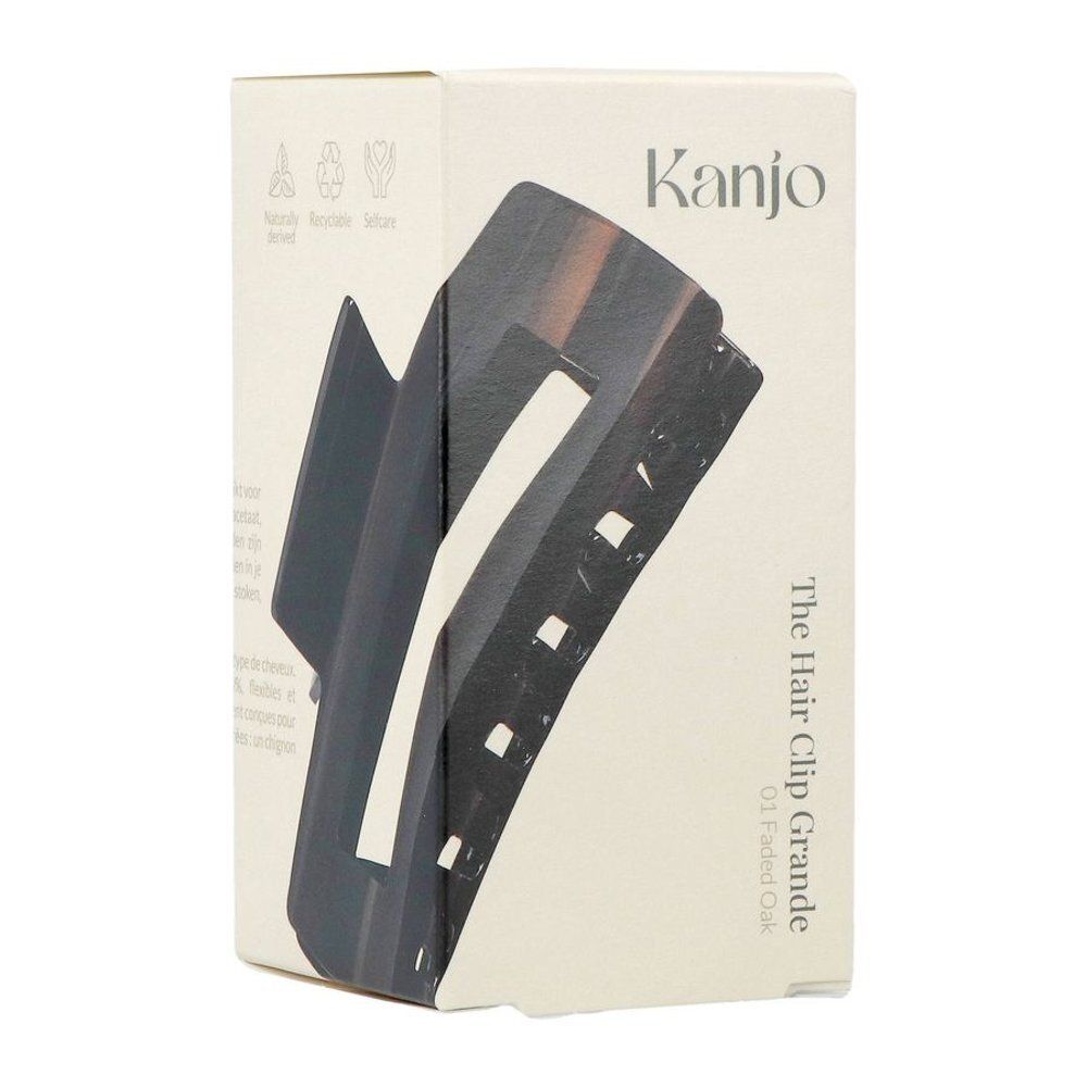 Emballage avec image du produit. Texte : Kanjo, The Hair Clip Grande 01 Faded Oak. Symboles de recyclage.