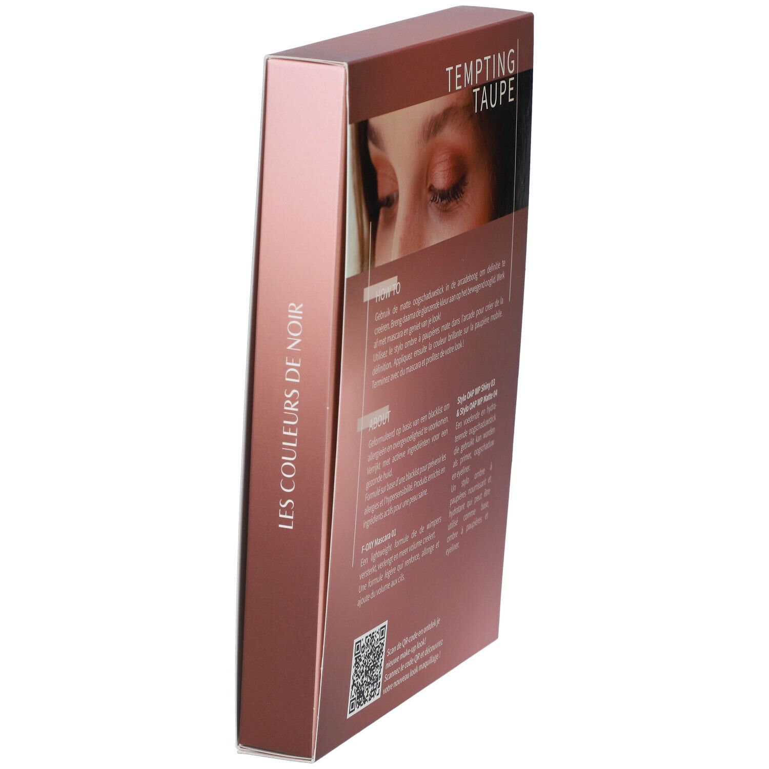 Schuinstaande geschenkdoos. Opschrift: LES COULEURS DE NOIR. Afbeelding van ogen. Tekst op de achterkant.