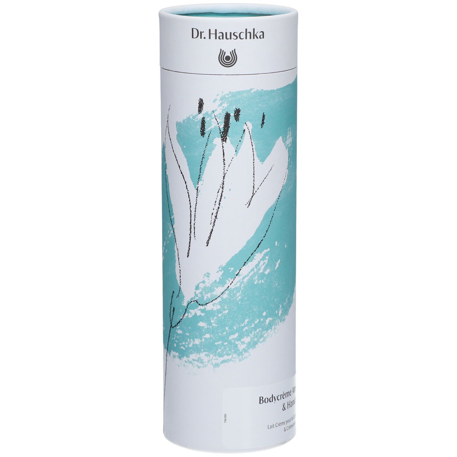 Emballage cylindrique avec motif floral et nom du produit. En haut : logo Dr. Hauschka. En bas : Bodycrème Amande & Crème de Mains.