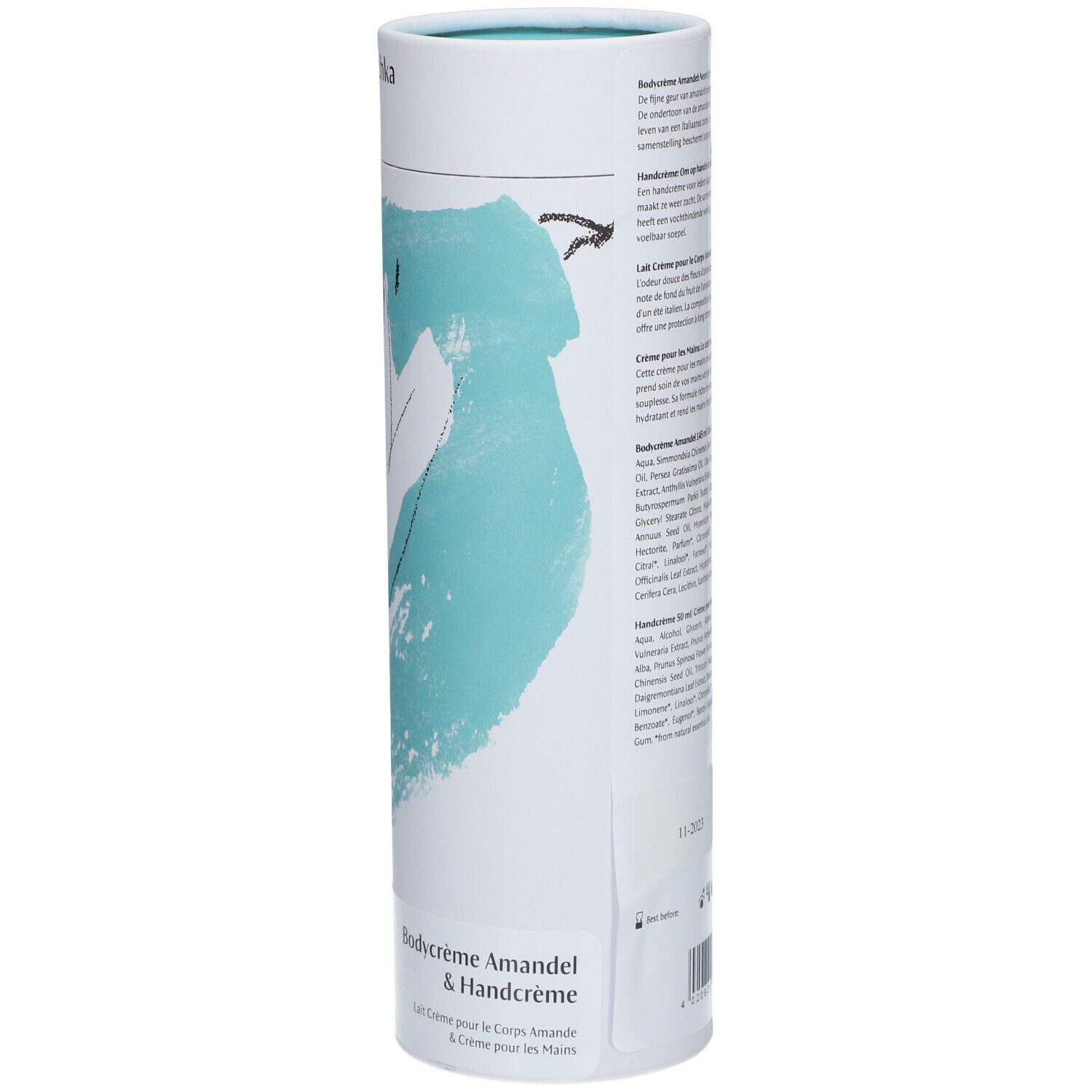 Vue latérale de l'emballage cylindrique. Motif floral et informations sur le produit. En haut : logo Dr. Hauschka. Texte en plusieurs langues.