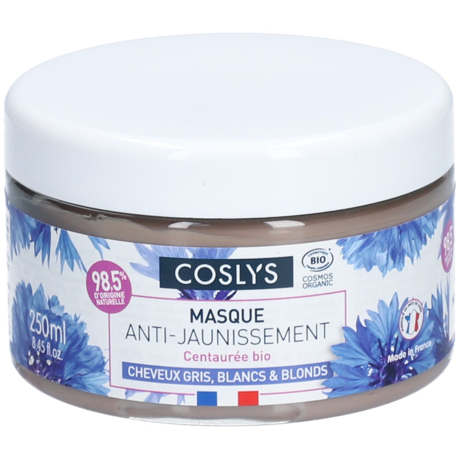 Ronde pot met witte deksel. Opschrift: Coslys Masque Anti-Jaunissement. Blauwe bloemmotieven. 250ml.