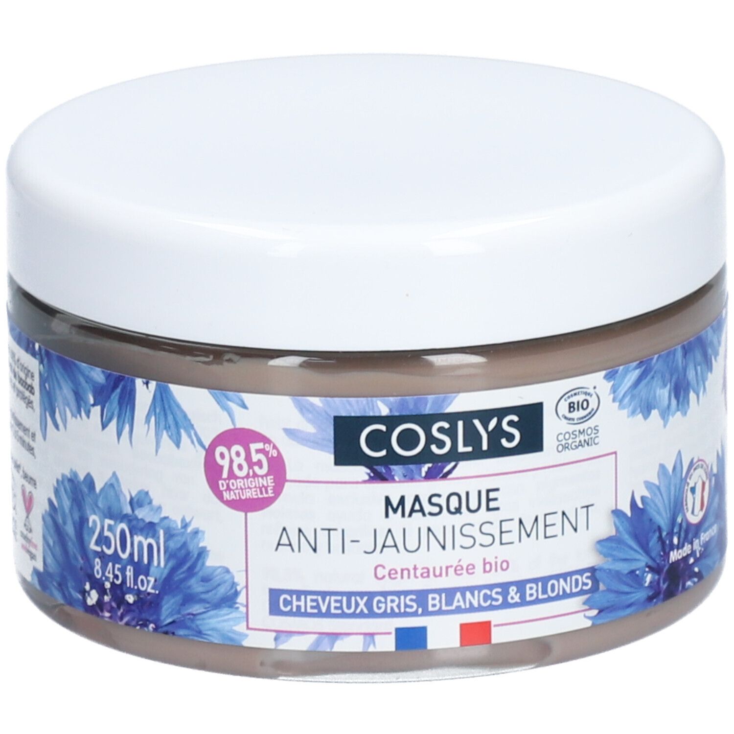 Ronde pot met witte deksel. Opschrift: Coslys Masque Anti-Jaunissement. Blauwe bloemmotieven. 250ml.