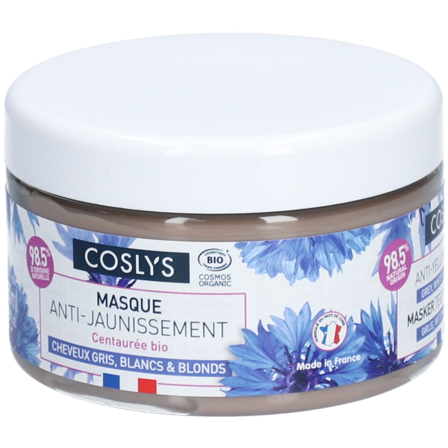 Ronde pot met witte deksel. Opschrift: Coslys Masque Anti-Jaunissement. Blauwe bloemmotieven. 250ml. Gemaakt in Frankrijk.