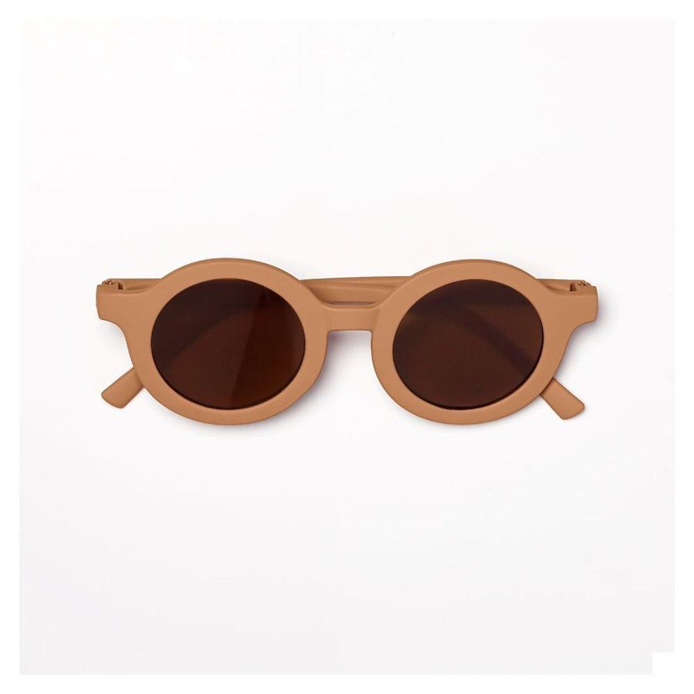 Lunettes de soleil rondes pour enfants, verres bruns, monture marron clair, vue de dessus.