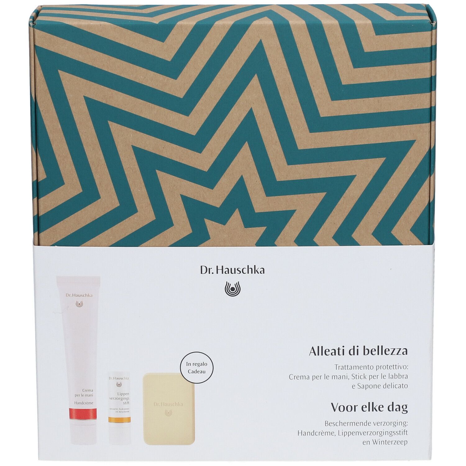 Coffret cadeau Dr. Hauschka avec crème pour les mains, stick à lèvres, savon. Emballage à motif d'étoiles.