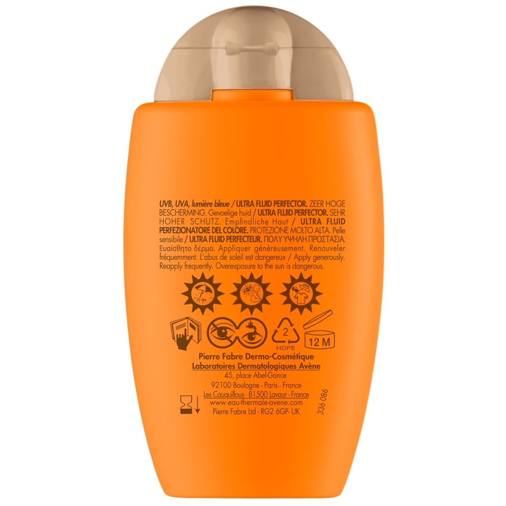 Achterkant van de oranje fles. Meertalige tekst. Pictogrammen.