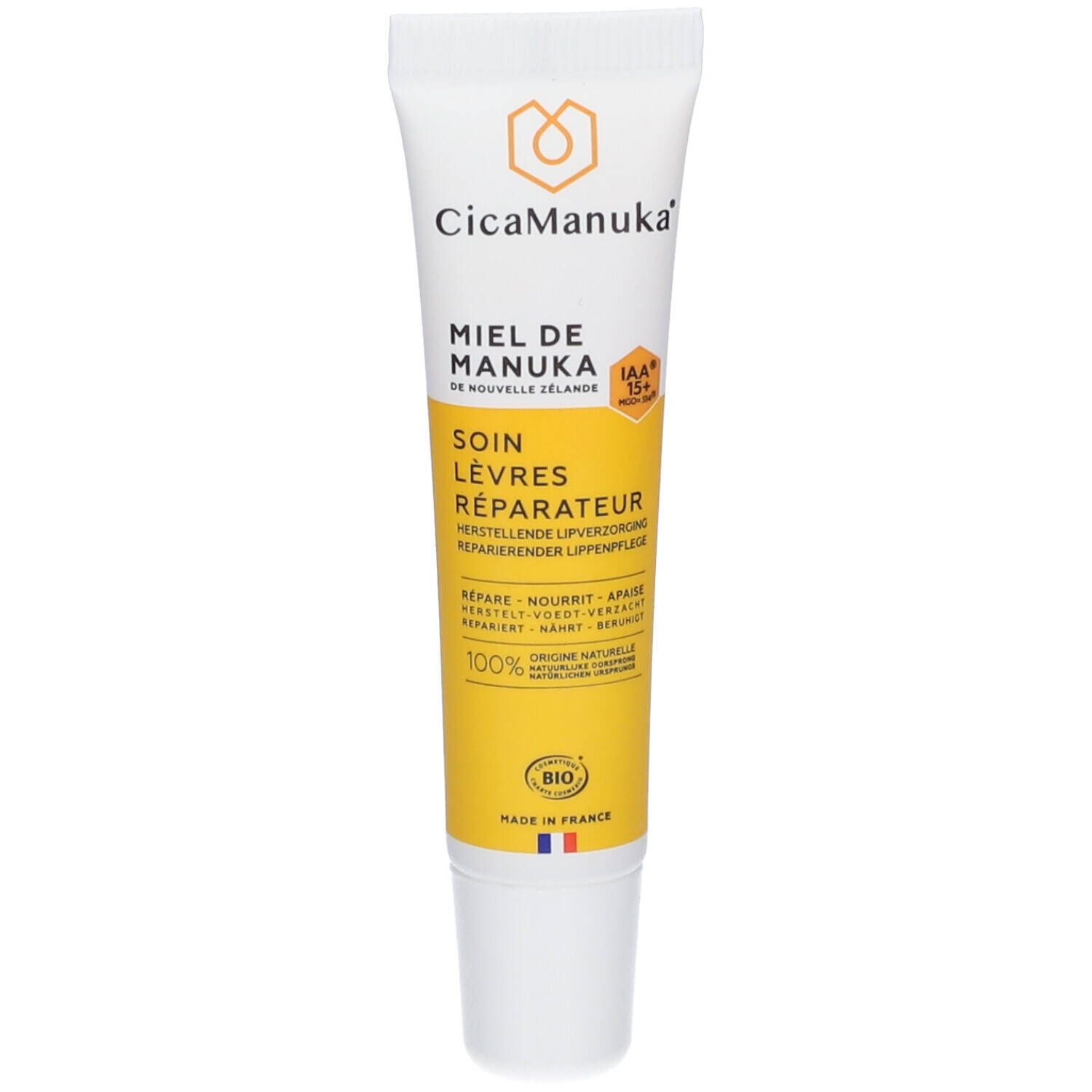 Tube de soin pour les lèvres CicaManuka®. Blanc, jaune. Texte: Soin Lèvres Réparateur, Miel de Manuka, 100% Origine Naturelle, Bio.