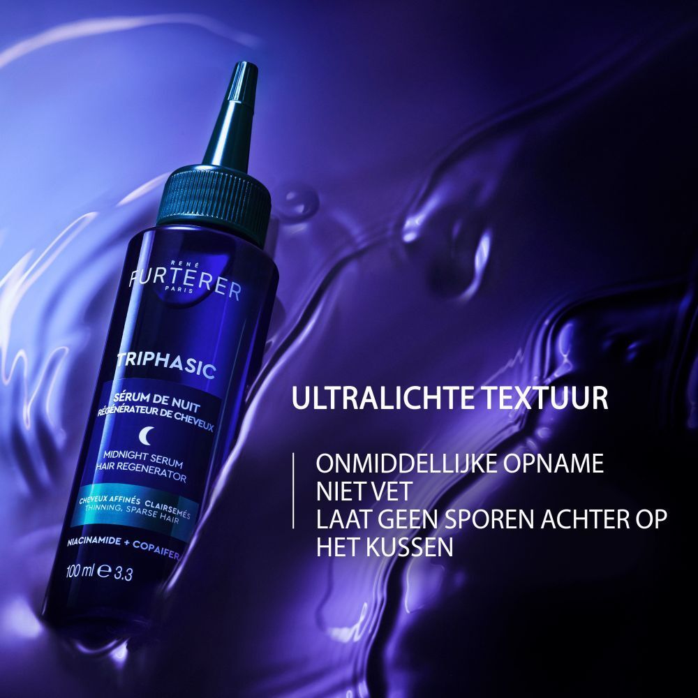 Donkerblauwe fles met druppeltop, gevuld met haarserum. Etiket: 'René Furterer Triphasic Serum de Nuit'.