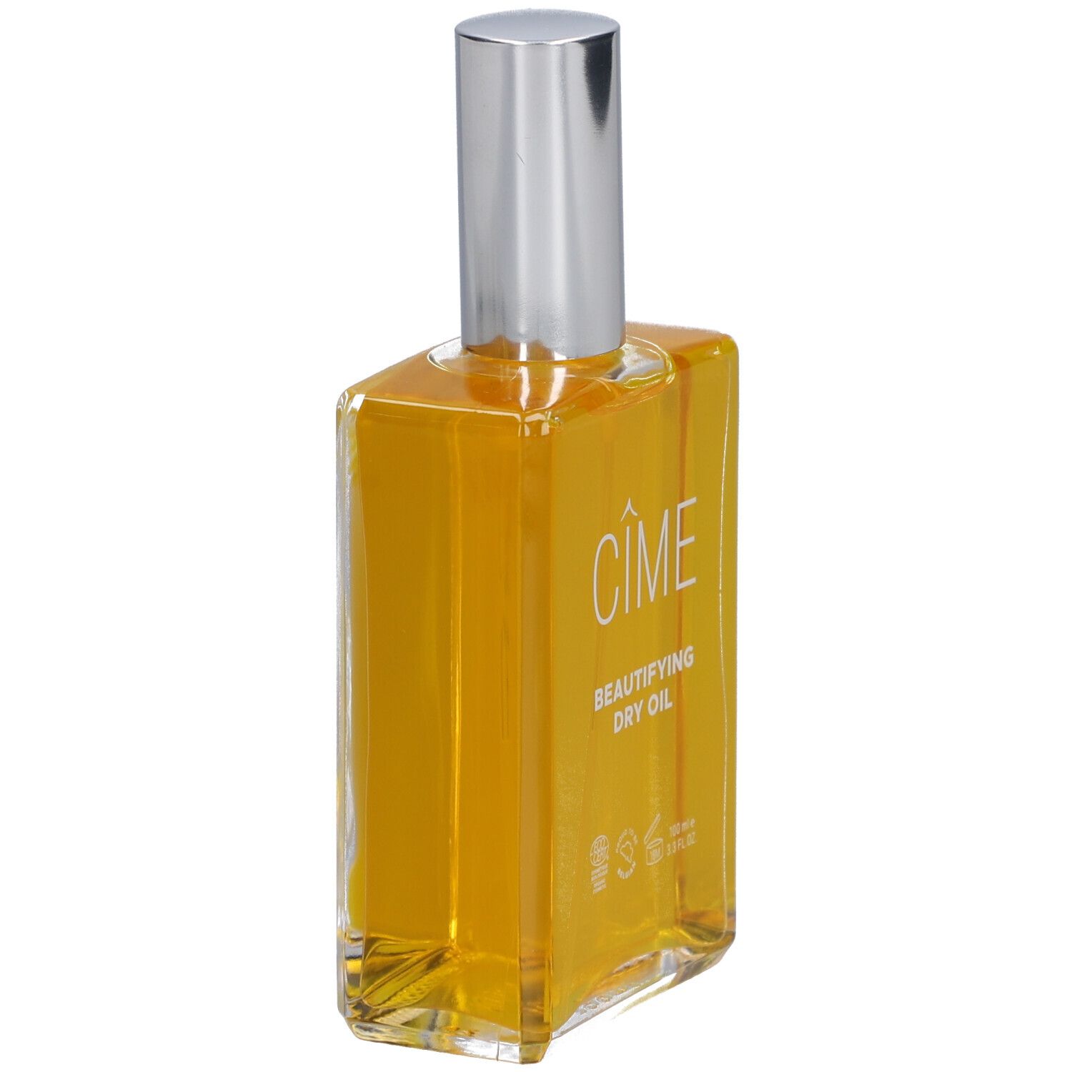 Glazen fles met gele olie, zilveren sproeikop. Cîme product.