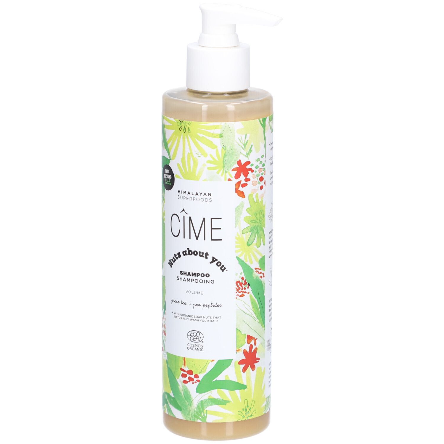 Shampoo fles met witte pomp. Opschrift: Cîme, Nuts about you, Shampooing Volume. Groen-wit bloemenpatroon.