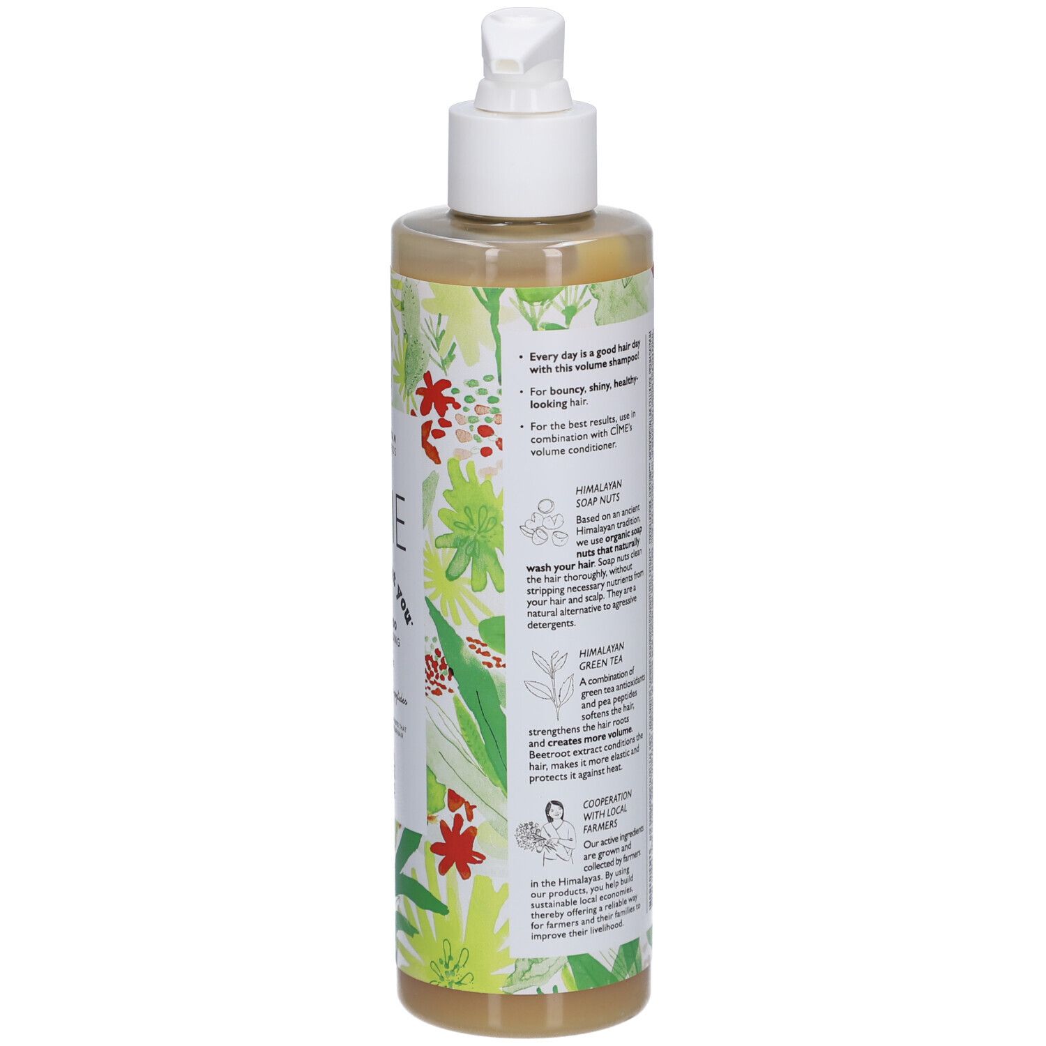Achterkant shampoo fles. Tekst: ingrediënten, gebruiksaanwijzing. Groen-wit bloemenpatroon. Witte dop.