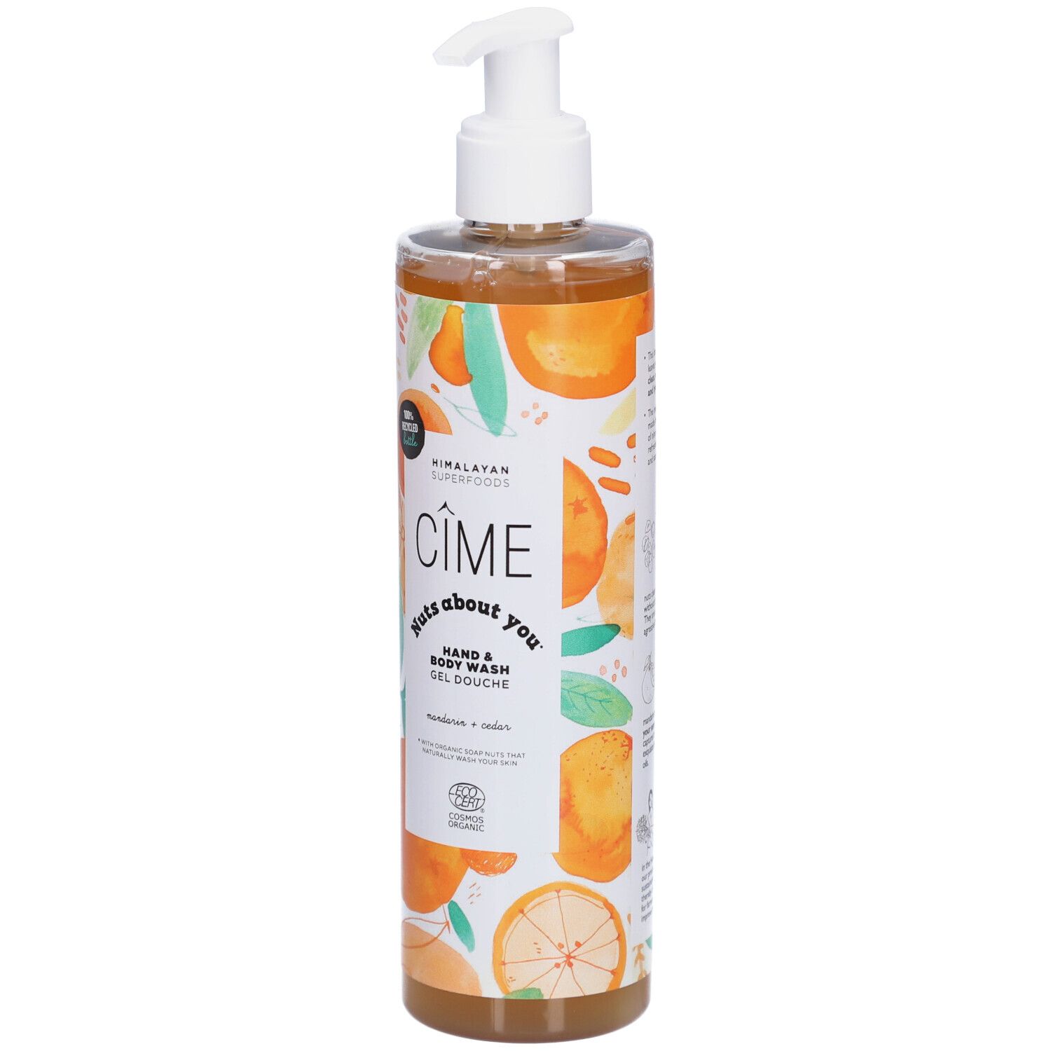 Transparante fles met witte pomp. Bedrukt met productnaam en sinaasappel illustraties. Biologische certificering.