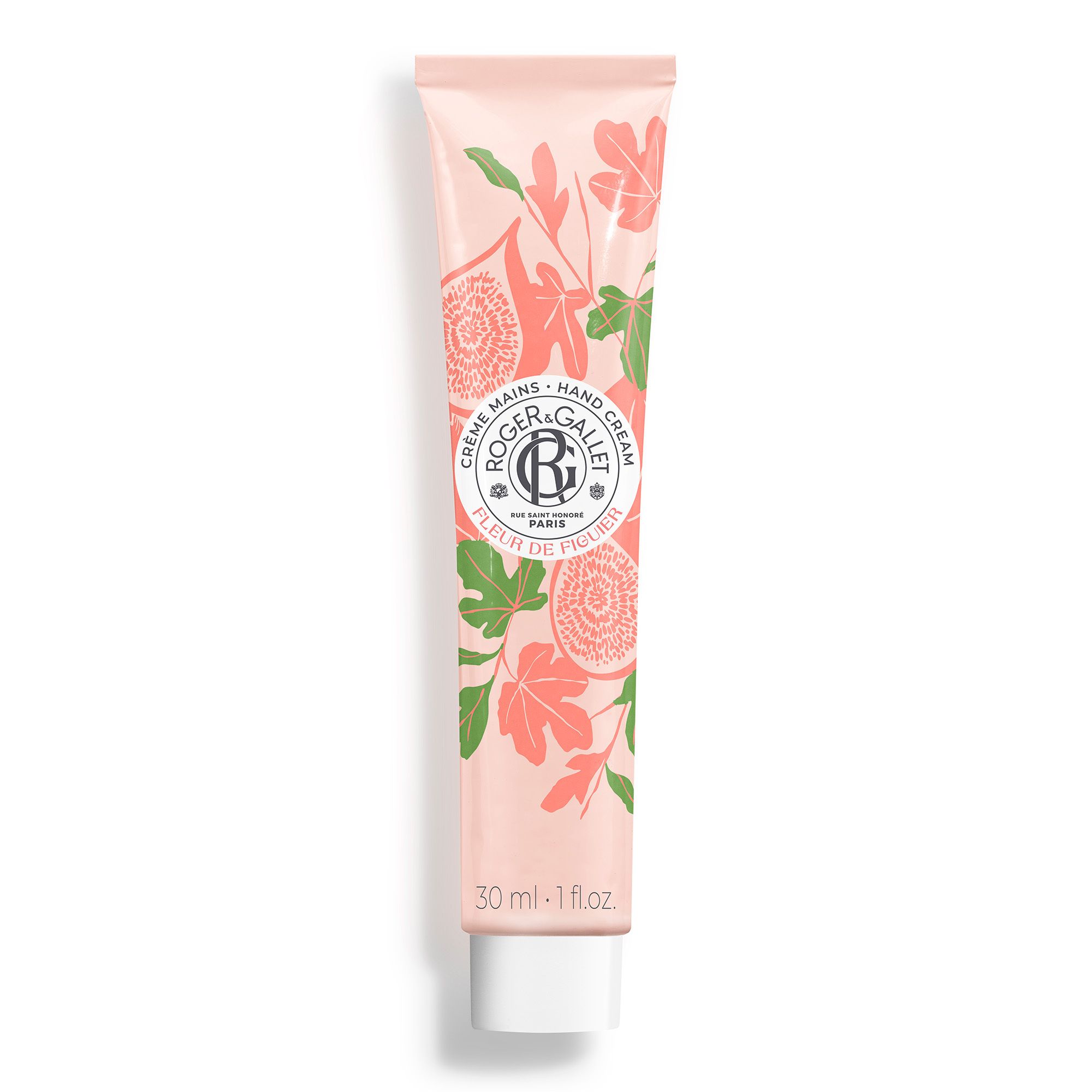Tube de crème pour les mains rose avec motif floral et logo. Texte: Crème Mains, Hand Cream, Fleur de Figuier. En bas: 30 ml - 1 fl oz.