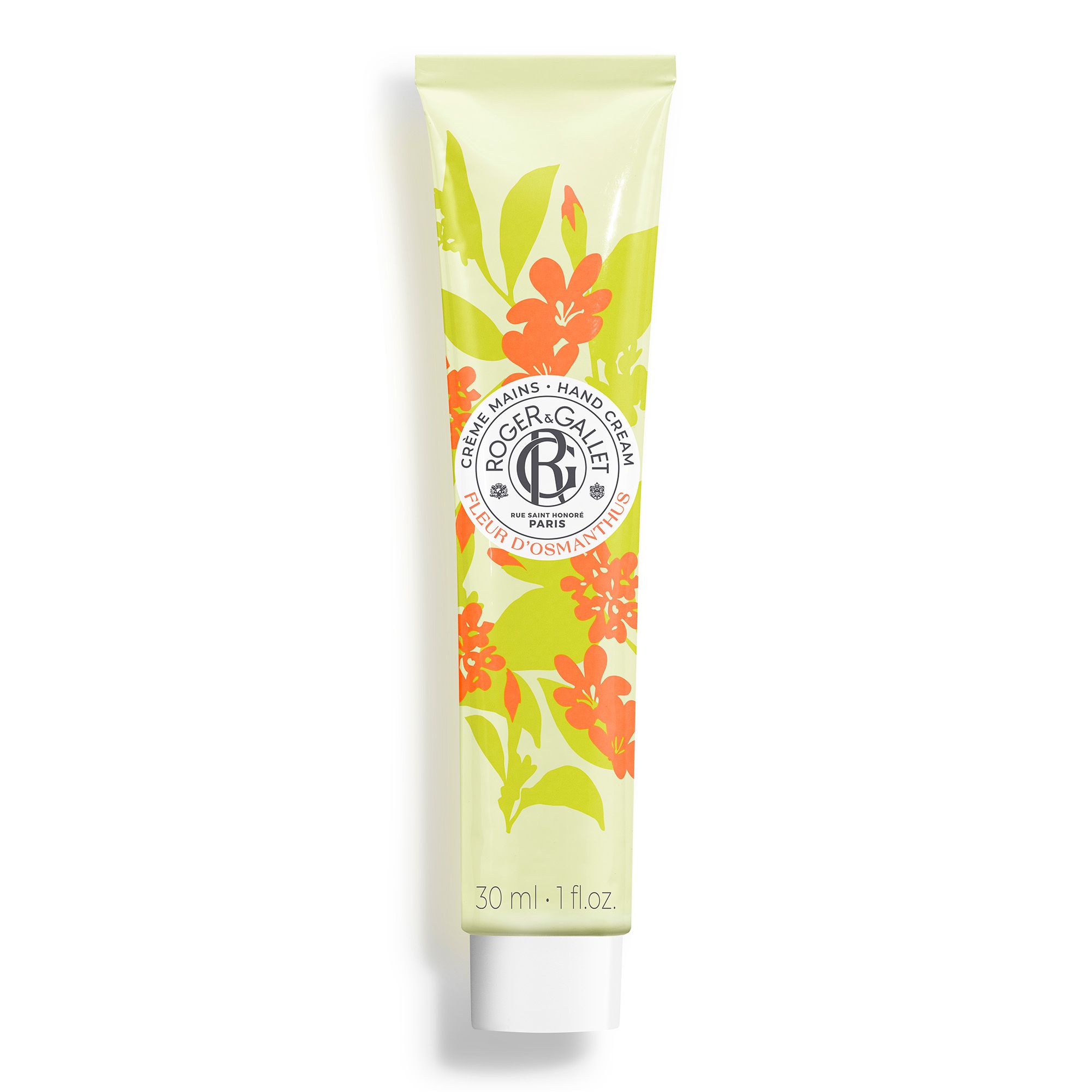 Handcrèmetube met bloemenpatroon. Logo en tekst. Oranje bloemen en groene bladeren op lichtgroene achtergrond. Onderaan staat "30 ml - 1 fl.oz".