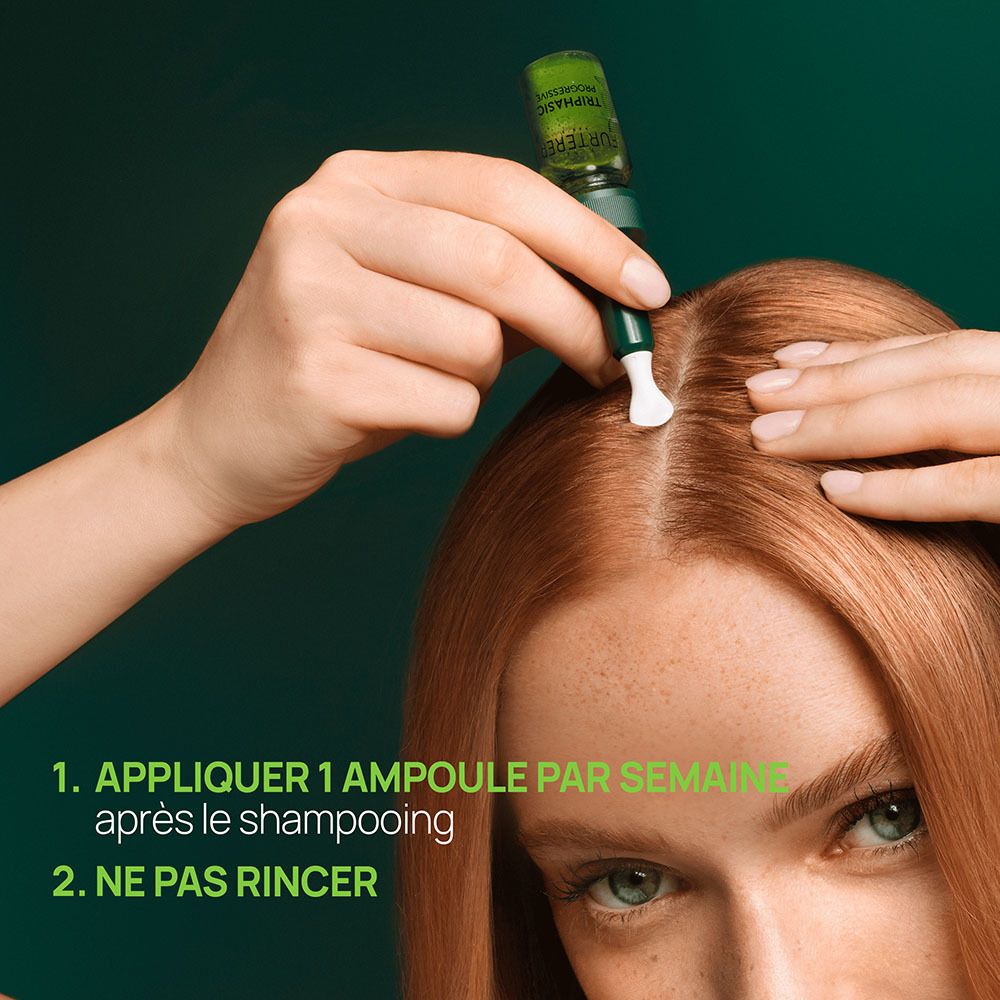 Application de l'ampoule René Furterer Triphasic. Femme aux cheveux roux.