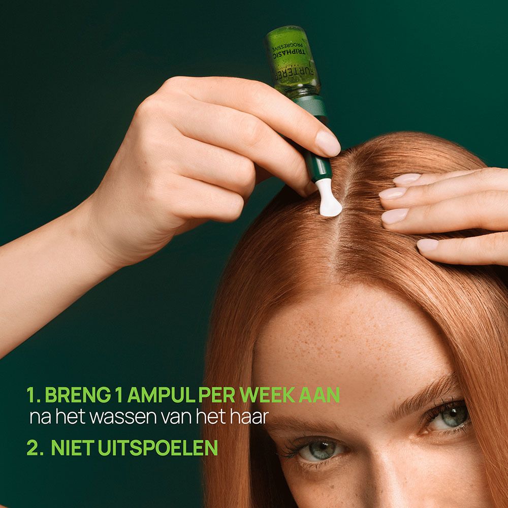 Toepassing van de René Furterer Triphasic ampul. Vrouw met rood haar.