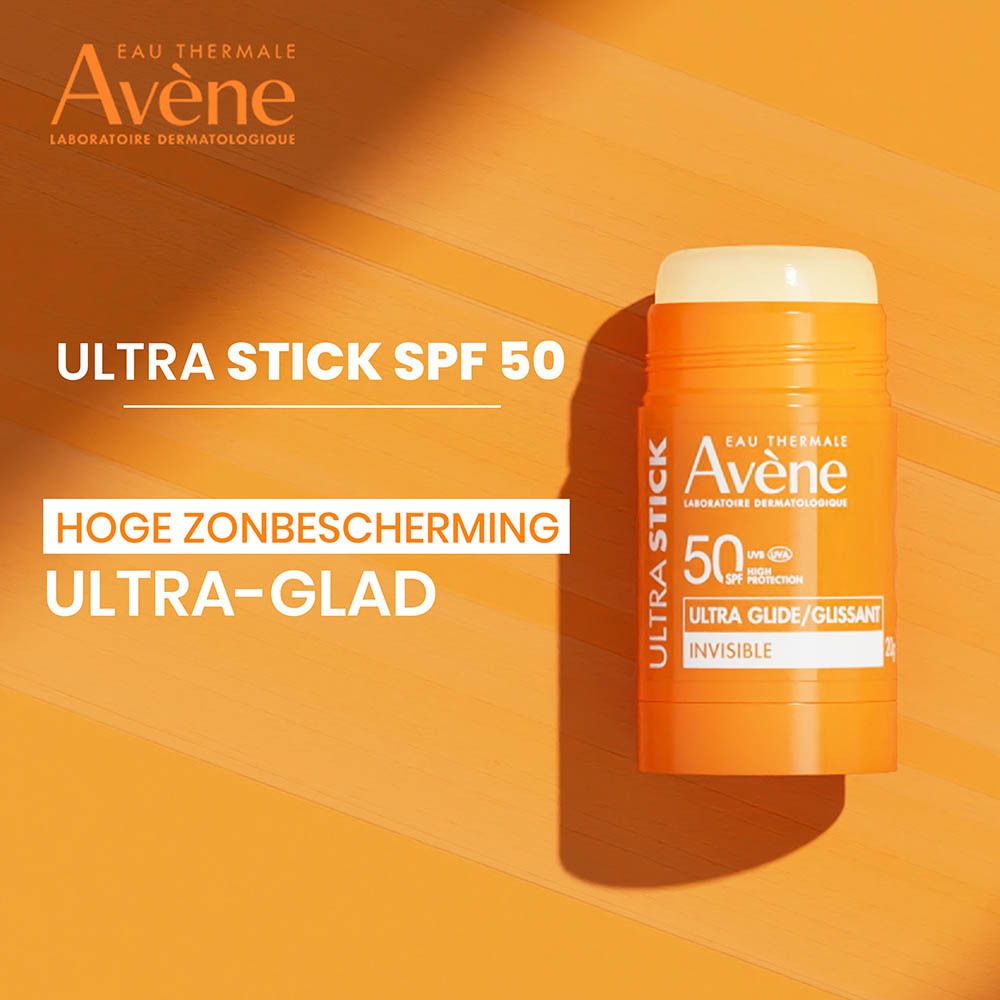 Oranje zonnestick. Merk Avène, Ultra Stick, SPF 50. Tekst: Ultra Glide/Glissant, Invisible.