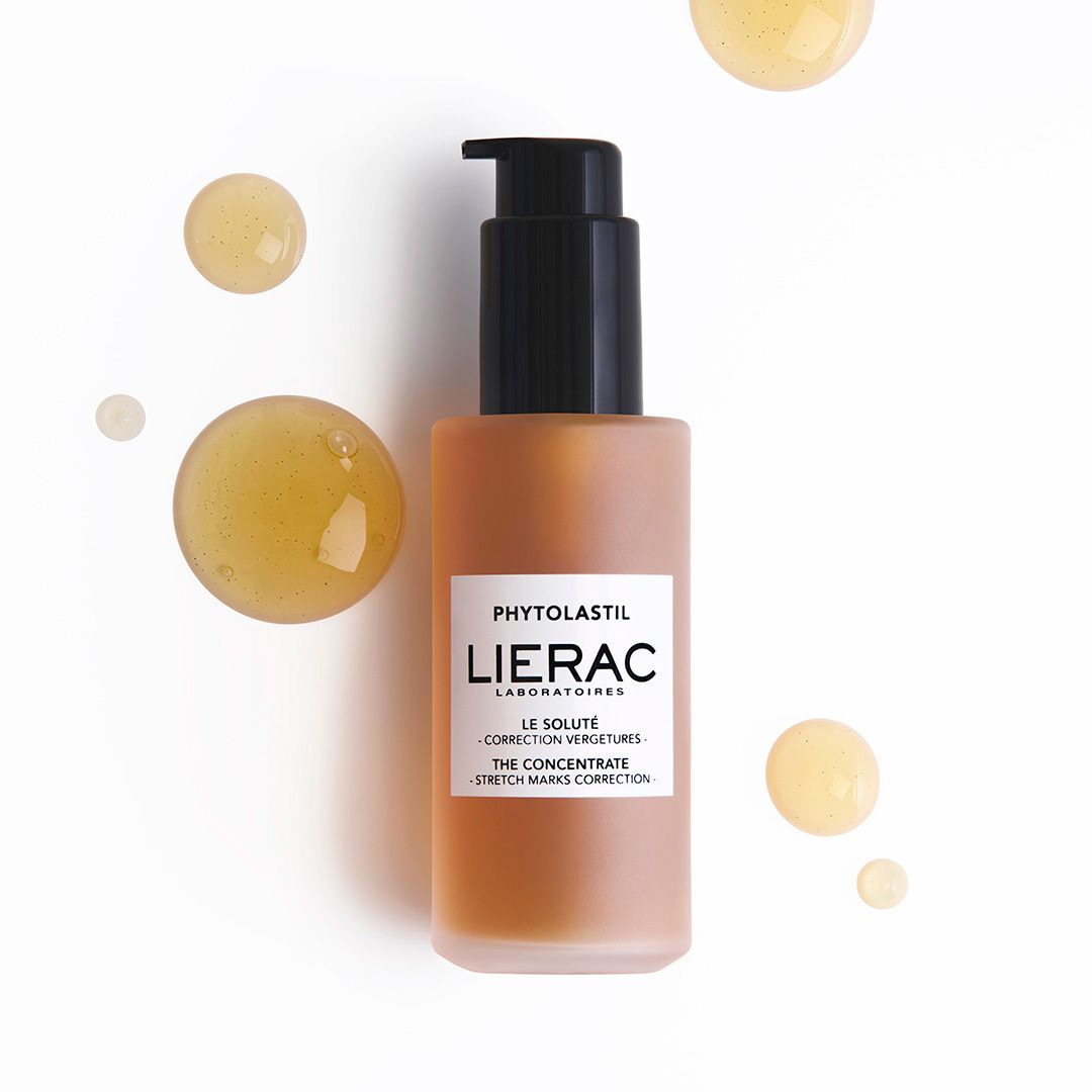 Productfles met druppels. Opschrift: Lierac, Phytolastil, Le Soluté. Druppels.