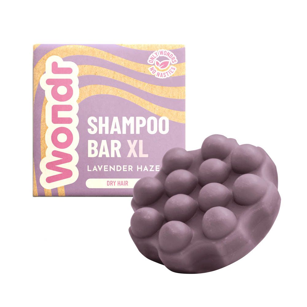 Shampoo Bar en verpakking. Paarse shampoo bar met verpakking. Tekst: Shampoo Bar XL, Lavender Haze. Merk: Wondr.