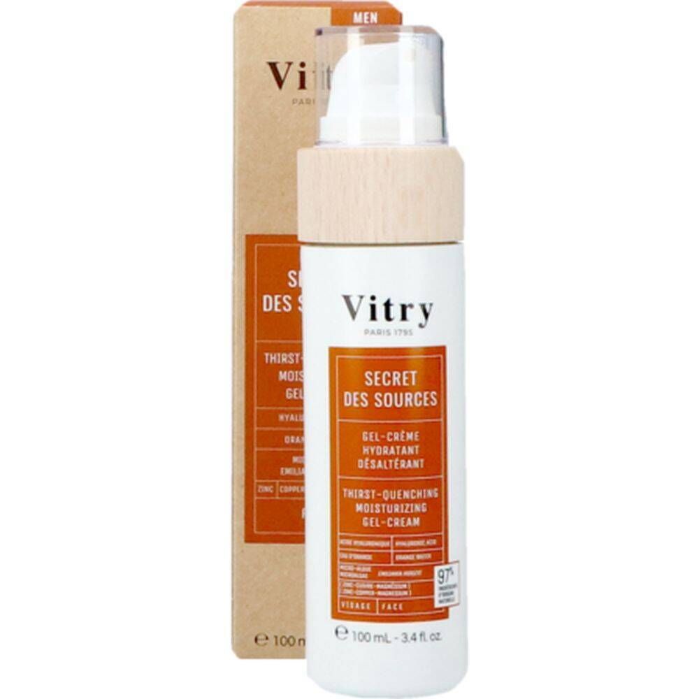 Flacon avec emballage carton. Flacon: blanc, pompe, bouchon bois. Étiquette orange. "Vitry" et "Secret des Sources" visibles.