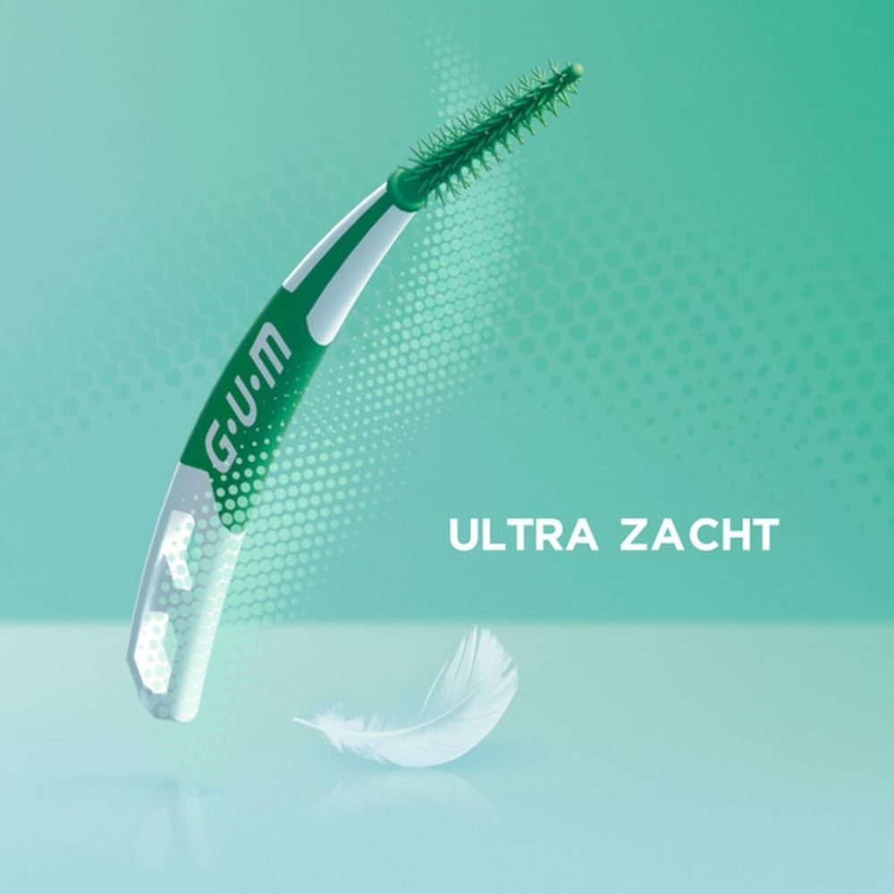 G.U.M. Soft-Picks Pro, los. Groen-witte borstel. Tekst: 'Ultra zacht'. Veer op de achtergrond.