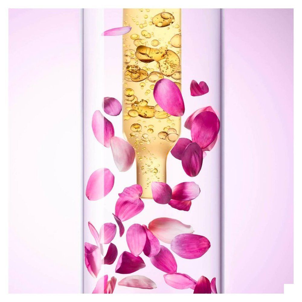NUXE Hair Prodigieux High Shine Conditioner tube met rozenblaadjes en olie.