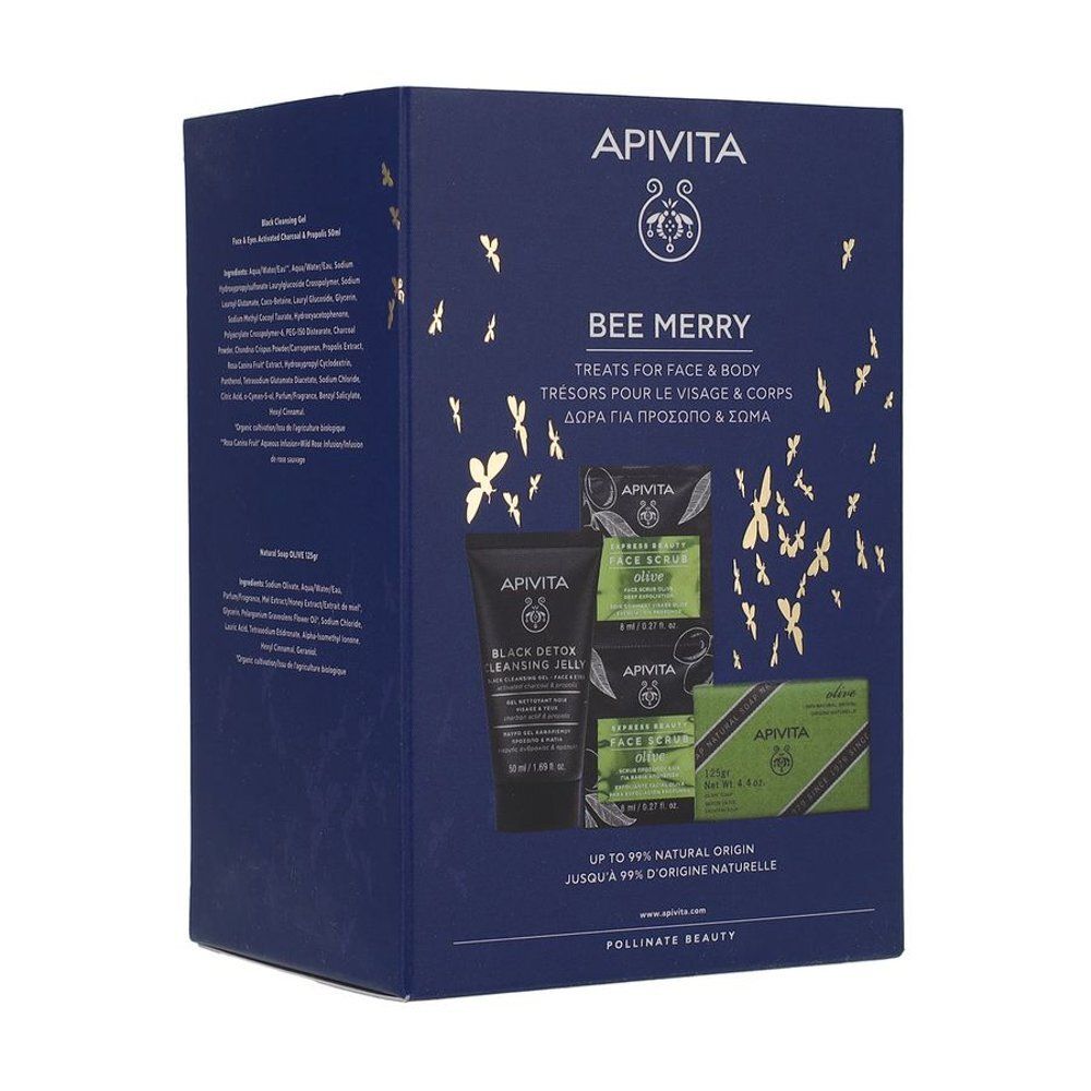 Donkerblauwe geschenkverpakking met gouden versieringen. Bevat producten voor gezicht en lichaam. Merk: APIVITA. Tekst: Bee Merry.