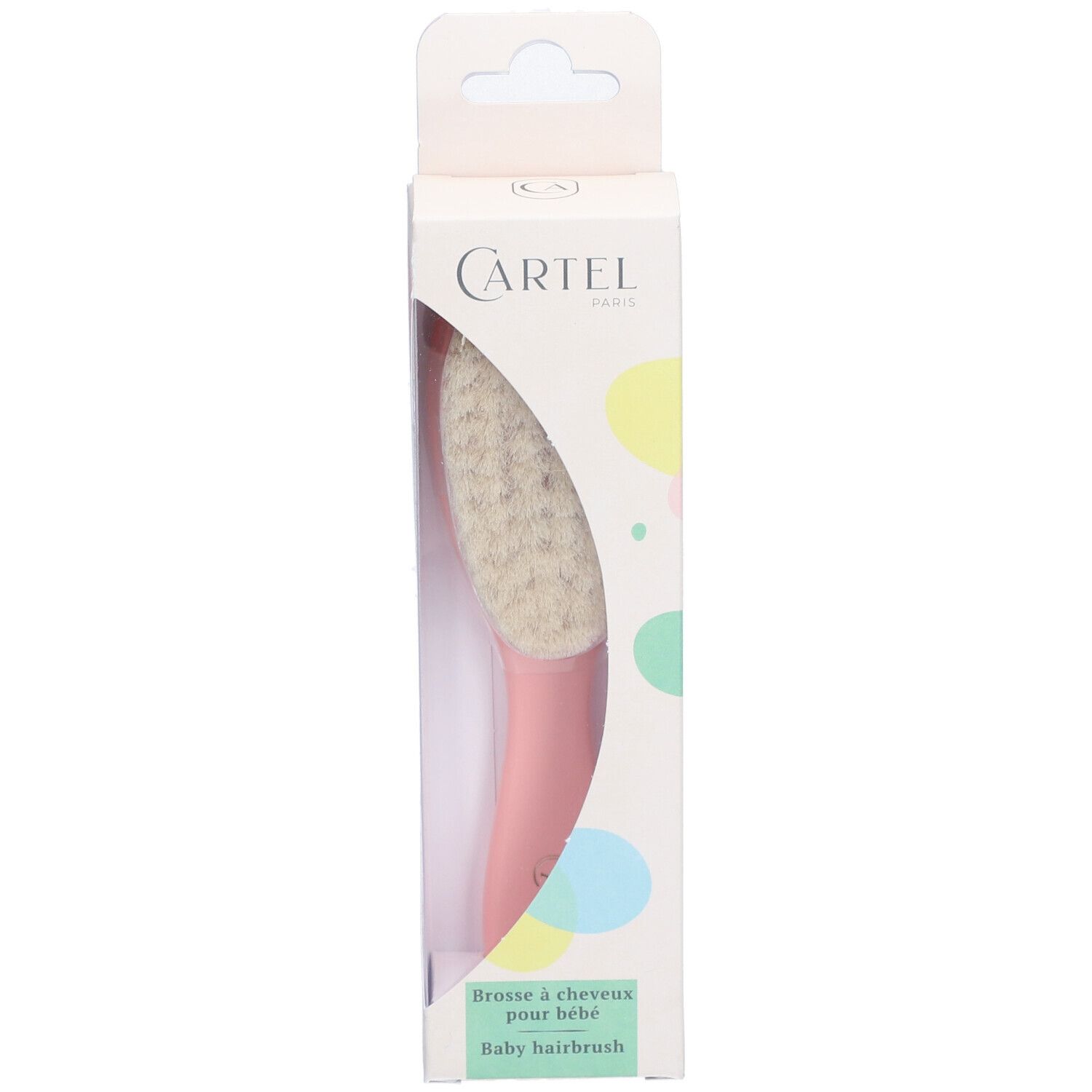 Brosse à cheveux pour bébé dans son emballage. Brosse avec tête en poils clairs et manche rose. Boîte avec logo.