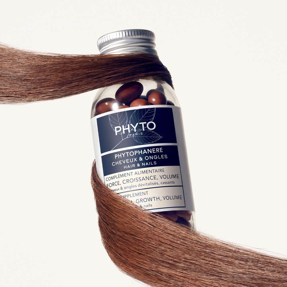 Productverpakking. Blauw-witte doos met productnaam en flesje capsules.