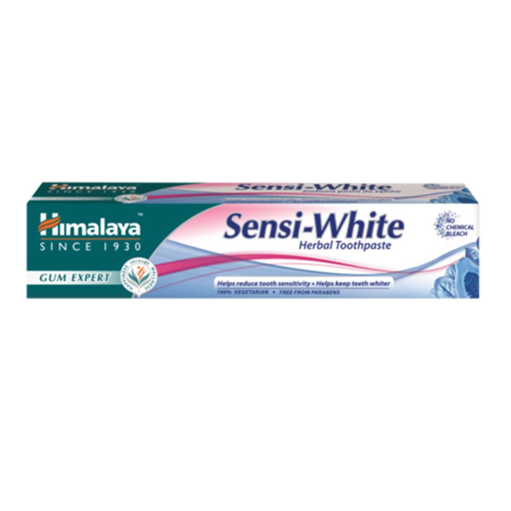 Tube de dentifrice "Himalaya Sensi-White". Design vert et blanc. Inscription "Herbal Toothpaste".