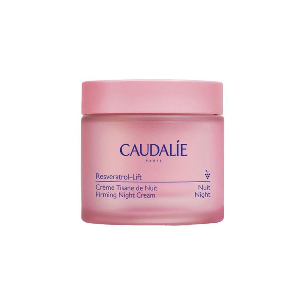 Pot de crème rose avec couvercle. Inscription CAUDALIE PARIS. Nom du produit et informations sur l'étiquette.