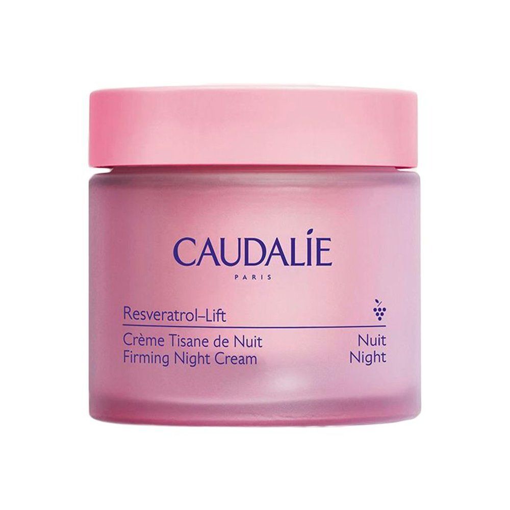 Pot de crème rose avec couvercle. Inscription CAUDALIE PARIS. Nom du produit et informations sur l'étiquette.