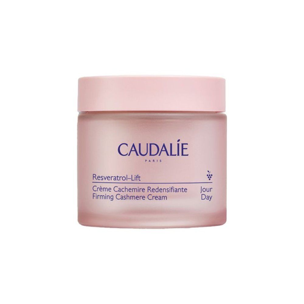 Pot rose avec couvercle. Inscription CAUDALIE PARIS. Texte: Resveratrol-Lift Crème Cachemire Redensifiante. Symbole jour.