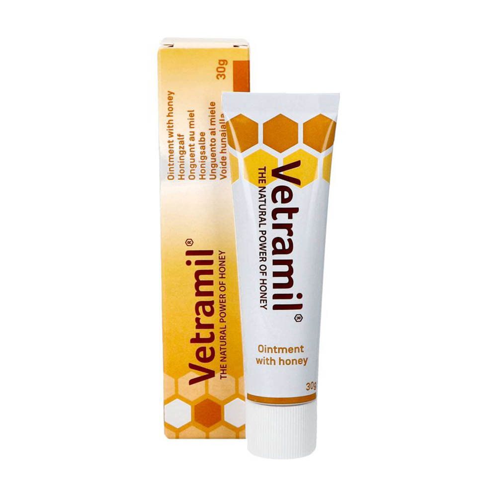Vetramil crème tube en doos. Tube en doos met gele accenten. Opschrift: Ointment with honey. 30g.