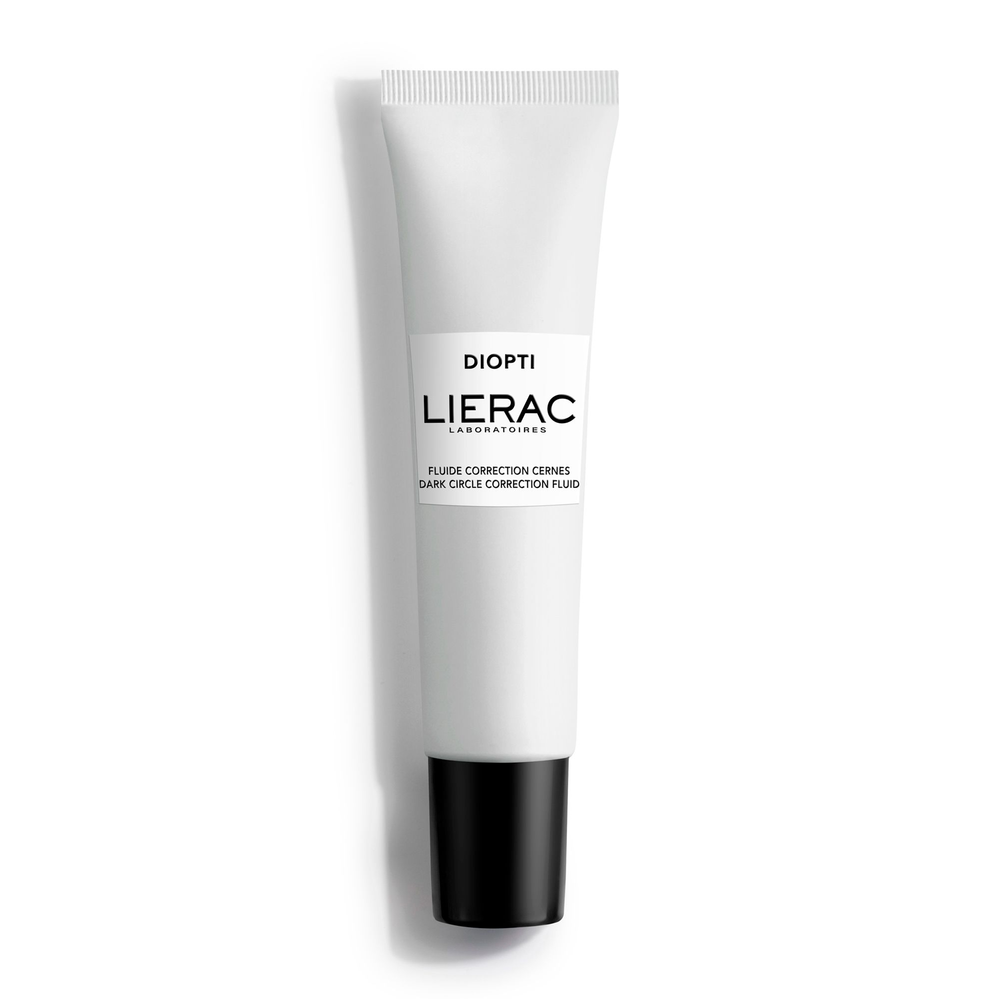 Tube blanc avec bouchon noir. Inscription: DIOPTI, LIERAC. Produit pour la correction des cernes.