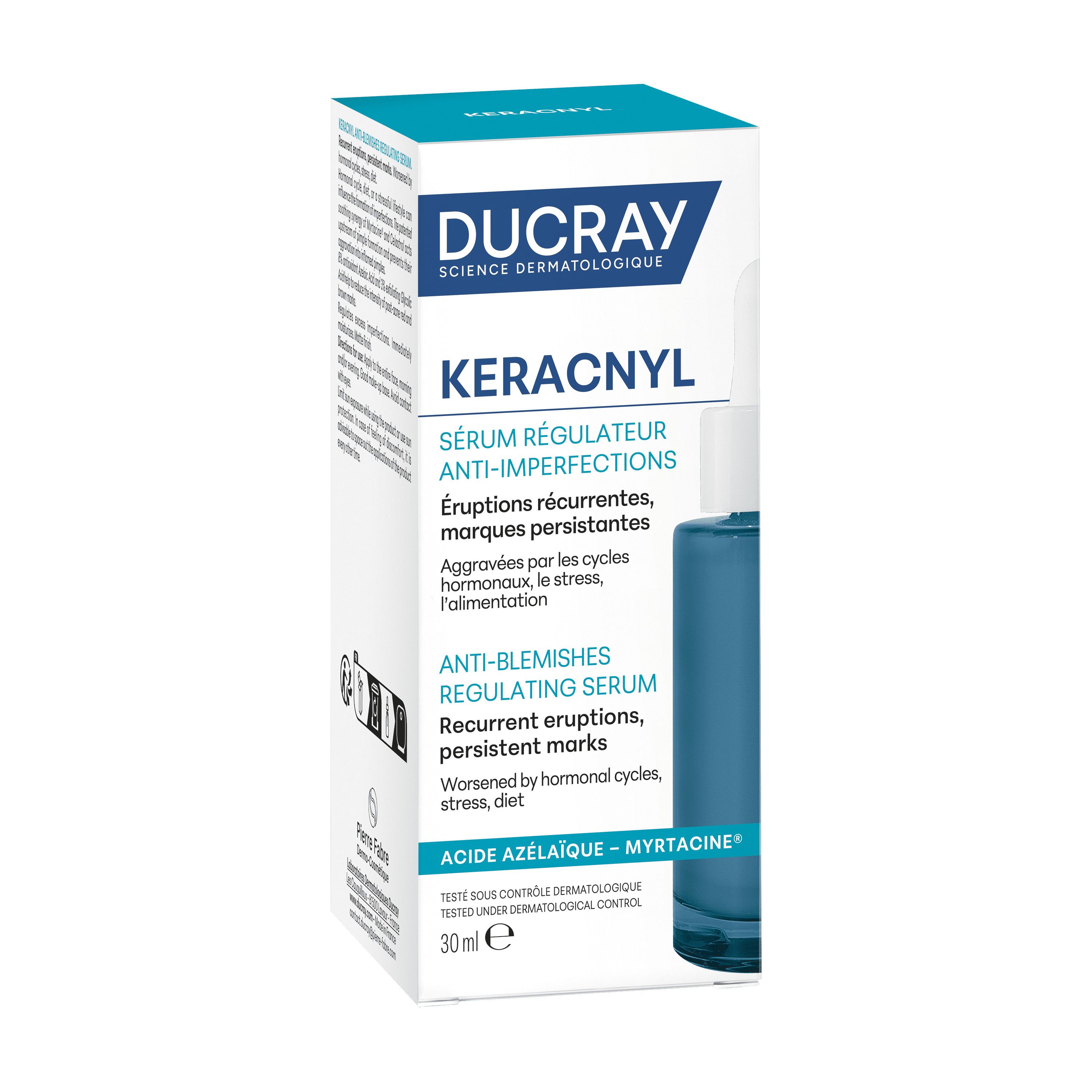 Achterkant van het blauwe serumflesje. Meertalige tekst. Opschrift: Ducray Keracnyl.