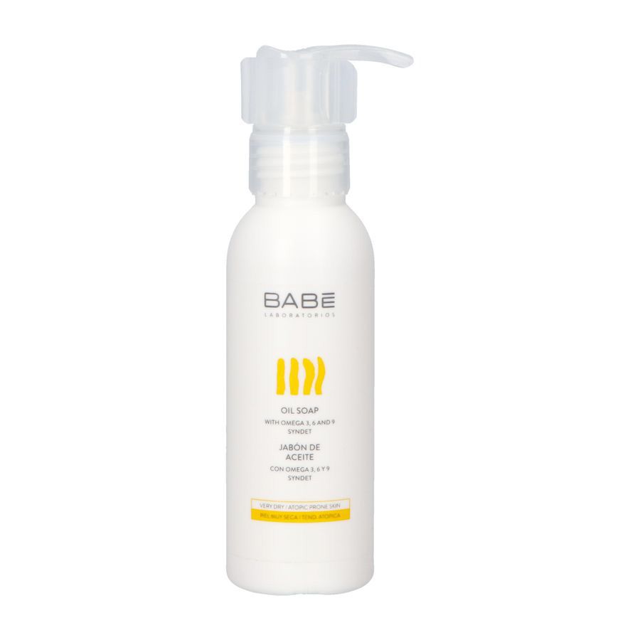 Witte fles met pomp. Opschrift BABE, geel design en tekst: OIL SOAP.