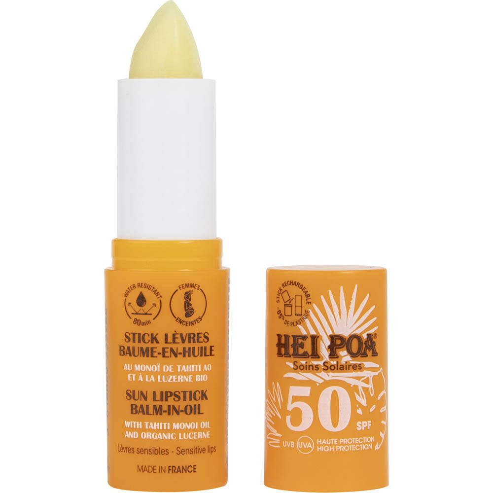 Gele lippenstift en open dop. Tekst: Hei Poa, Soins Solaires, Stick Lèvres Baume-en-Huile, Sun Lipstick Balm-in-Oil.