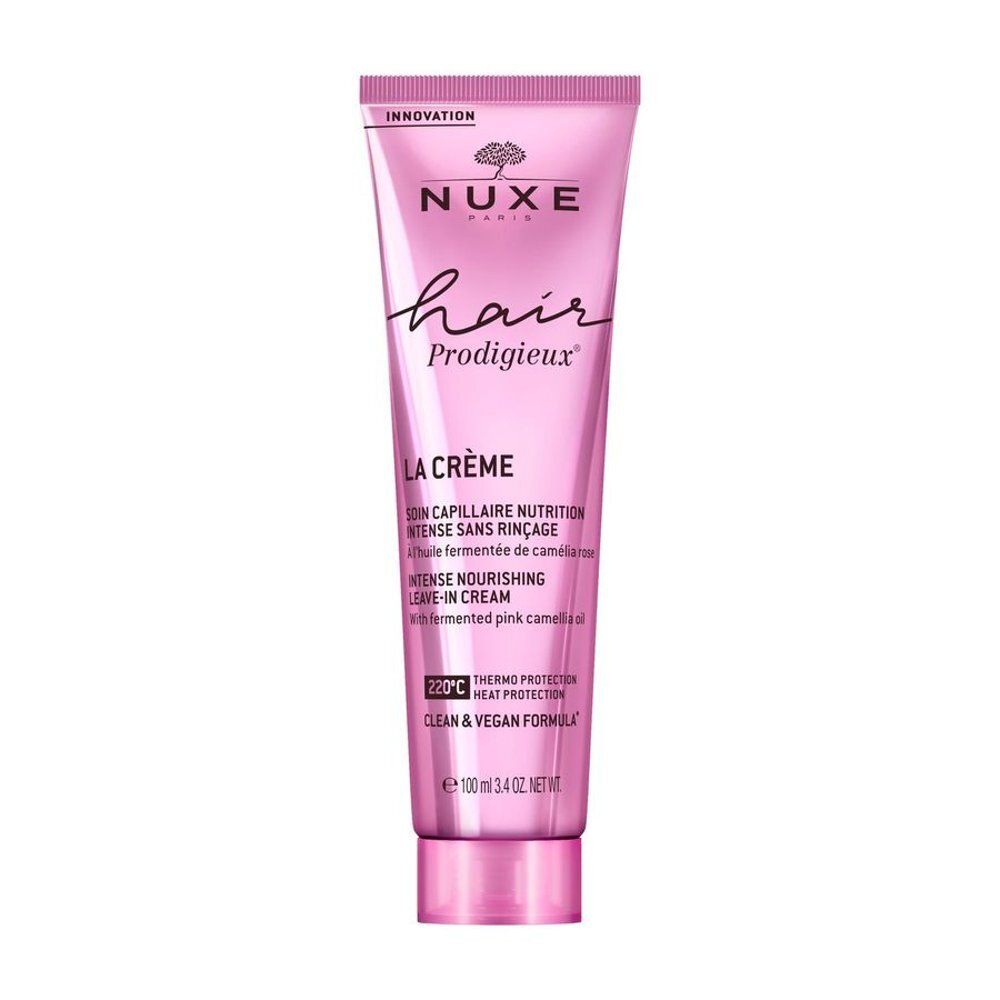 Nuxe Hair Prodigieux leave-in crème tube, roze, met productinformatie.