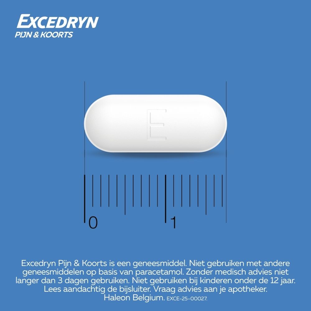 Een enkele witte tablet met de letter 'E' erop ligt op een liniaal.