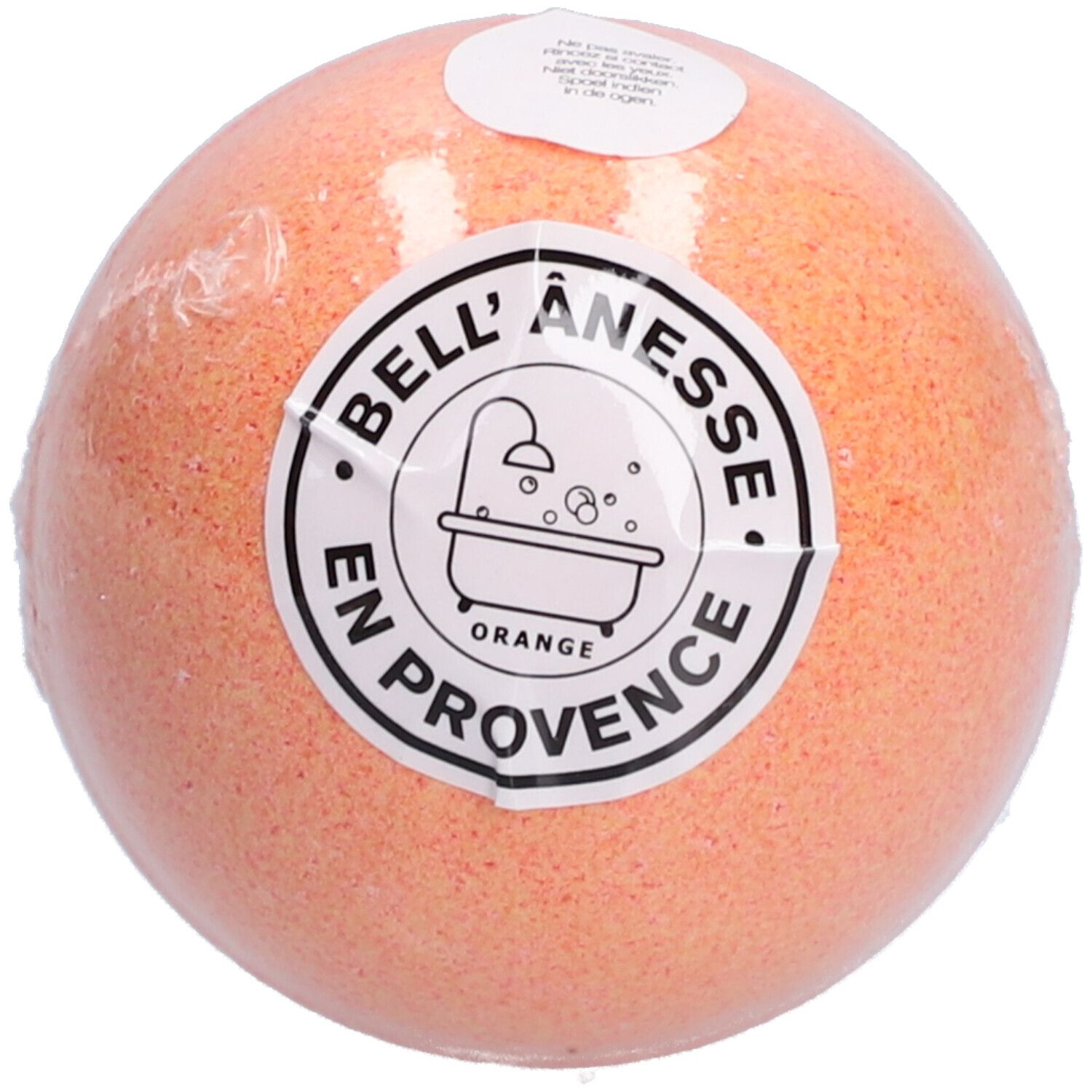 Oranje bal, verpakt. Label met tekst en badkuipsymbool. "Bell'Ânesse" en "Orange" zichtbaar.