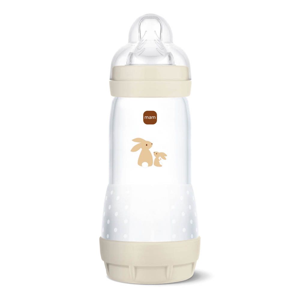 Babyfles met dierenmotief en beige bodem en ring.
