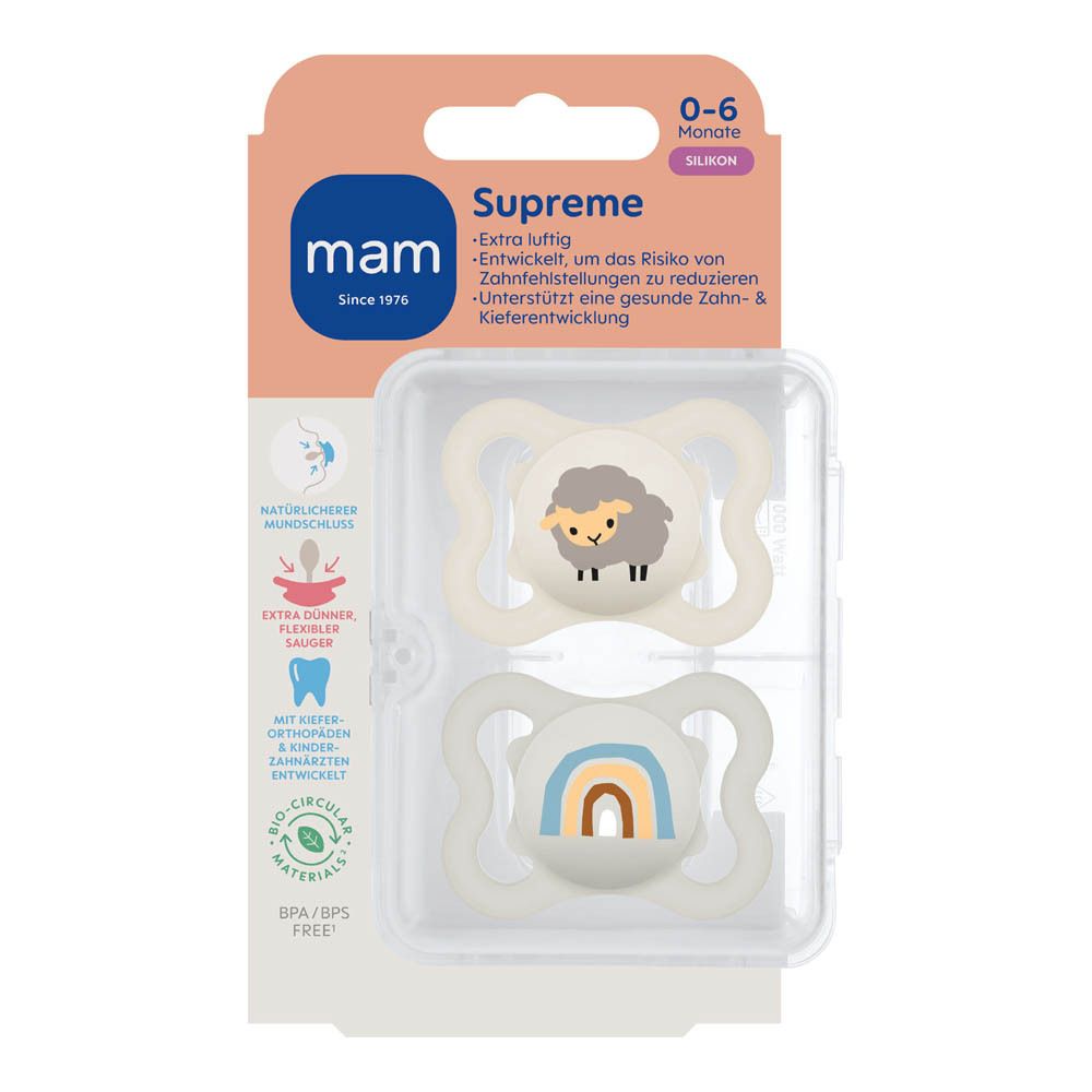Gros plan de l'emballage des sucettes MAM Supreme en silicone avec motifs dinosaure et feuilles.