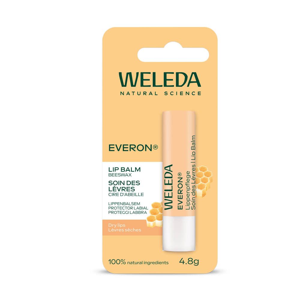 Soin des lèvres Weleda Everon® dans son emballage. Carte jaune avec produit et illustration en nid d'abeilles.