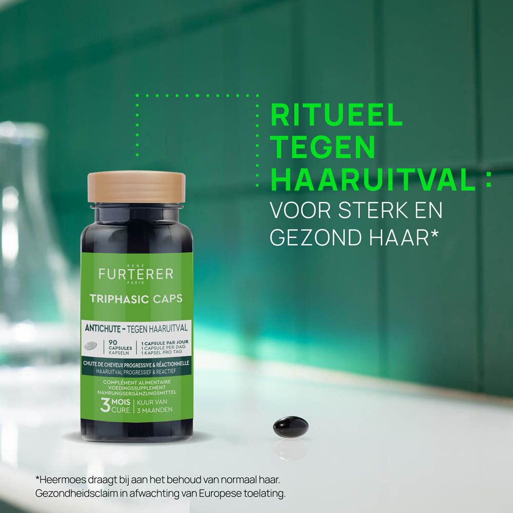Flesje en capsule. Tekst: Ritueel tegen haaruitval. Voor sterk en gezond haar.