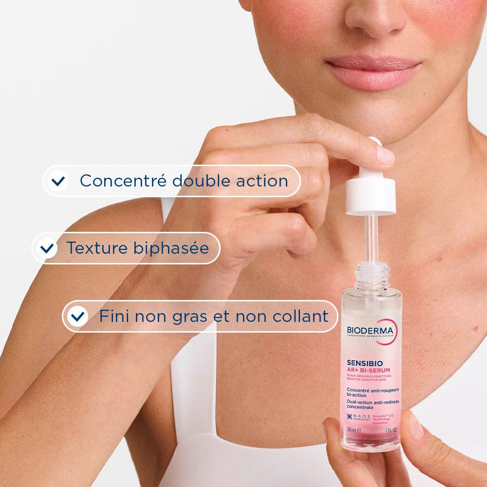 Flacon de Bioderma Sensibio AR+ Bi-Sérum avec pipette. Sérum rose et blanc. Inscription Sensibio AR+ Bi-Sérum.